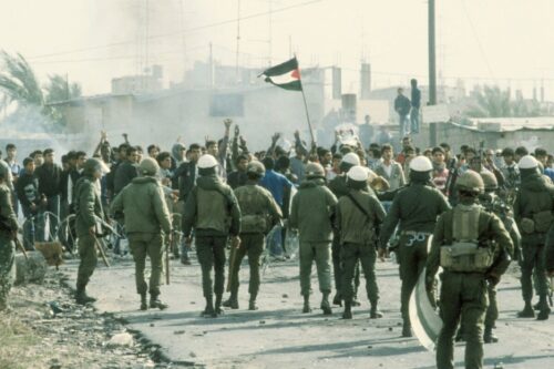 Palestinian protestors confront Israeli troops in Gaza City, 1987, during the First Intifada [21 Dec 1987, Sharir Efi / Israel Press and Photo Agency (I.P.P.A.) / Dan Hadani collection, National Library of Israel / Wikimedia]